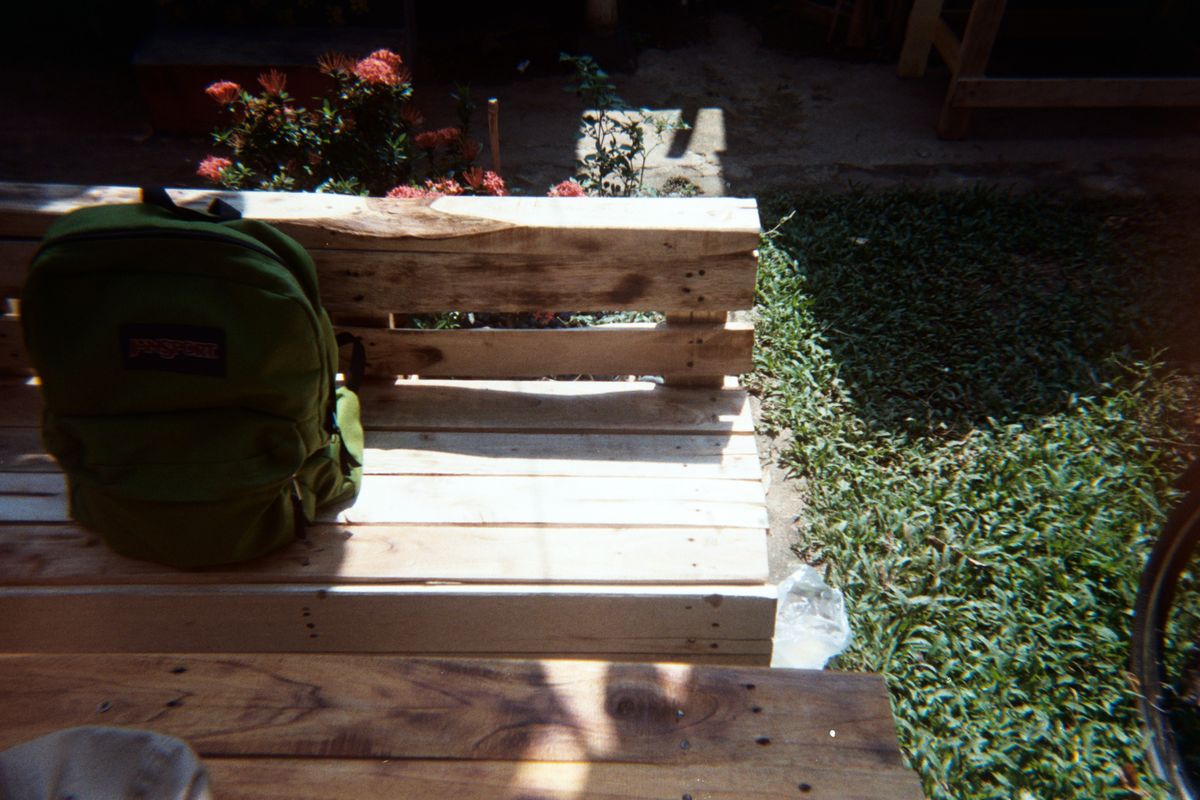 A backpack resting on a bench